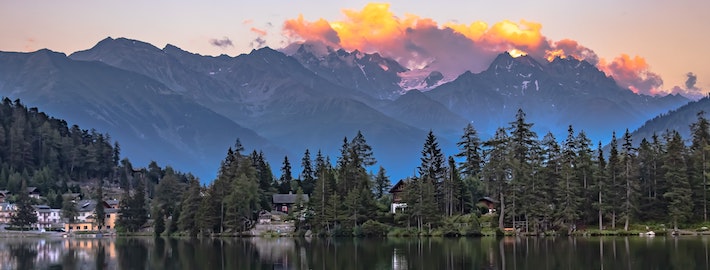 A sunset on top of swiss valleys